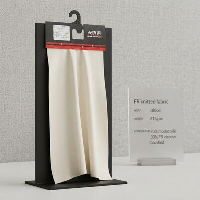 Tessuto a maglia ignifugo, larghezza 180 cm, peso 215 g/m² con 70% modacrilico e 30% viscosa ignifuga per applicazioni ignifughe
