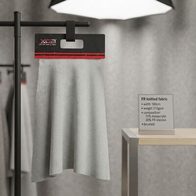 Tessuto a maglia ignifugo, larghezza 180 cm, peso 215 g/m² con 70% modacrilico e 30% viscosa ignifuga per applicazioni ignifughe